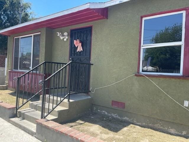 10807 Compton Ave, Los Angeles, CA 90059 - entrance to property featuring stucco siding