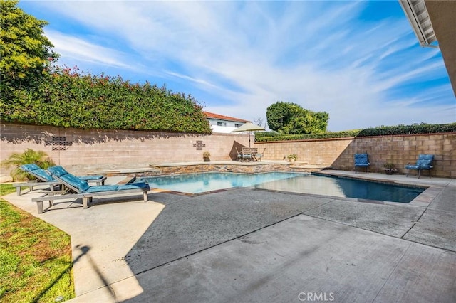 view of pool with a patio area, a fenced in pool, and a fenced backyard