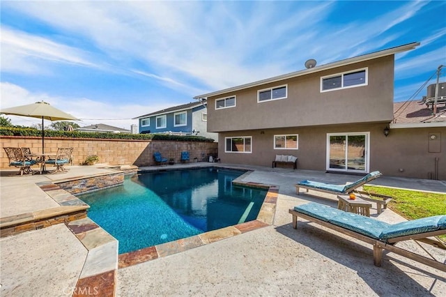 view of pool with a fenced in pool, a patio area, and fence