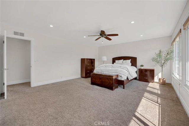 carpeted bedroom with recessed lighting, visible vents, baseboards, and a ceiling fan