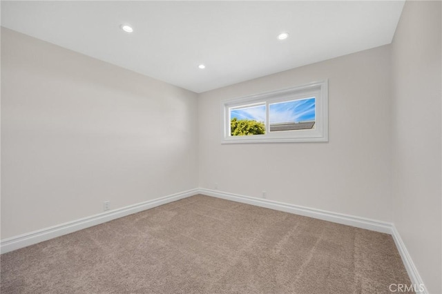 unfurnished room with carpet flooring, recessed lighting, and baseboards