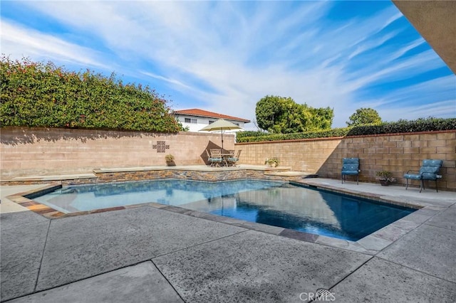 view of swimming pool with a fenced in pool, a patio, and a fenced backyard