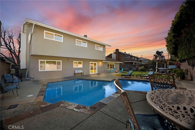 view of swimming pool featuring a patio area, a fenced in pool, and a fenced backyard