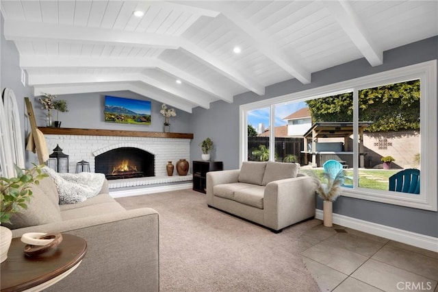 living room featuring recessed lighting, a brick fireplace, vaulted ceiling with beams, and baseboards