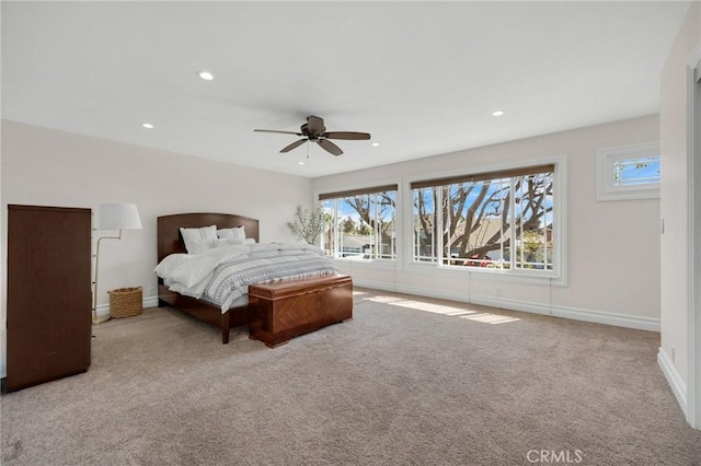 carpeted bedroom featuring recessed lighting, baseboards, and a ceiling fan