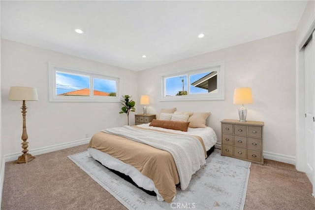 carpeted bedroom with recessed lighting, a closet, and baseboards