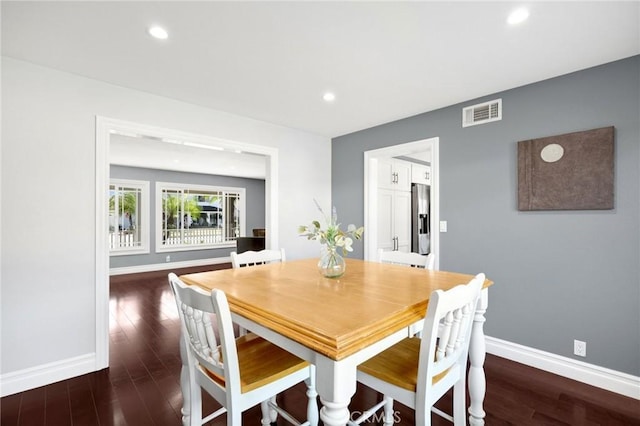 dining area featuring visible vents, recessed lighting, baseboards, and wood finished floors