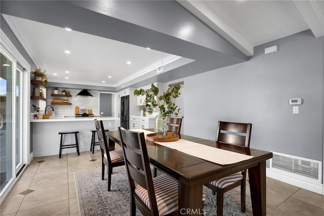 dining room with crown molding, light tile patterned floors, recessed lighting, and visible vents