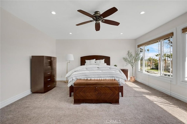 bedroom with recessed lighting, light colored carpet, baseboards, and ceiling fan