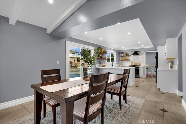 dining area with light tile patterned floors, recessed lighting, lofted ceiling with beams, and baseboards