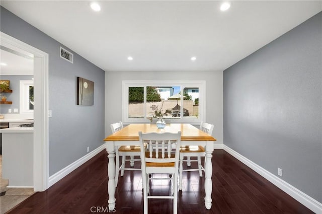 dining space with visible vents, recessed lighting, baseboards, and wood finished floors