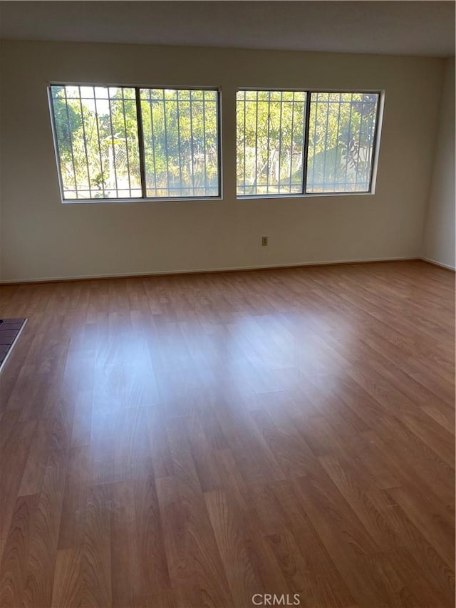 unfurnished room featuring wood finished floors