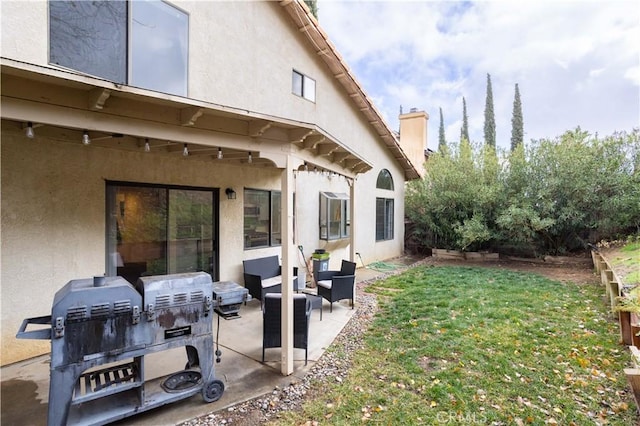 view of yard featuring outdoor lounge area and a patio area