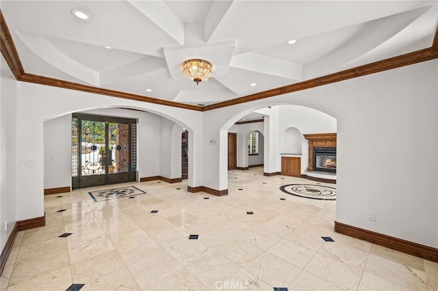 805 E Chase Dr, Corona, CA 92881 - entrance foyer featuring a glass covered fireplace, marble finish floor, recessed lighting, baseboards, and ornamental molding