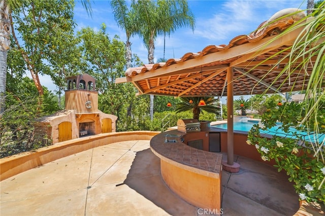 805 E Chase Dr, Corona, CA 92881 - view of patio / terrace with area for grilling, an outdoor fireplace, and a grill