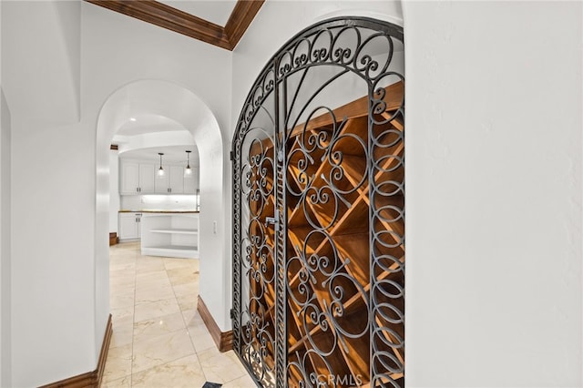 805 E Chase Dr, Corona, CA 92881 - wine cellar with baseboards, arched walkways, marble finish floor, and ornamental molding