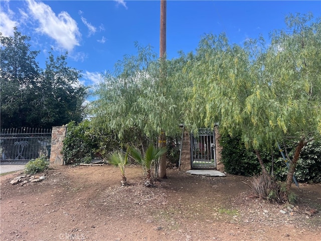 view of yard with a gate and fence