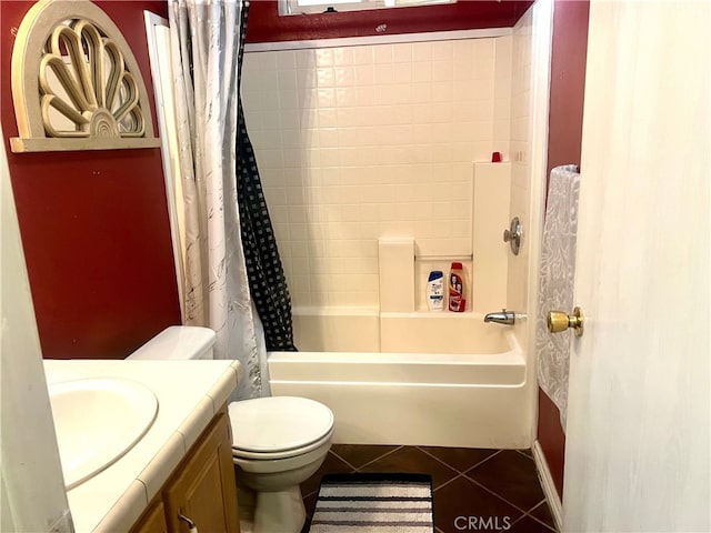 full bath featuring tile patterned floors, toilet, vanity, and shower / bath combination with curtain