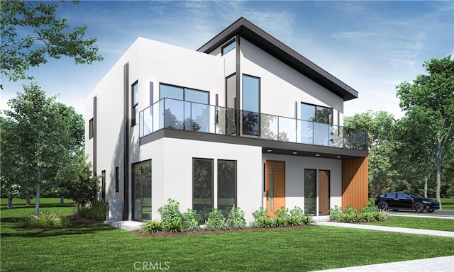 contemporary home with stucco siding, a balcony, and a front lawn