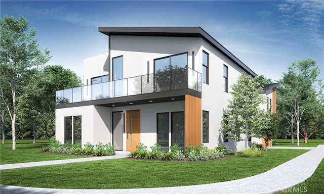 view of front facade with a front lawn, a balcony, and stucco siding