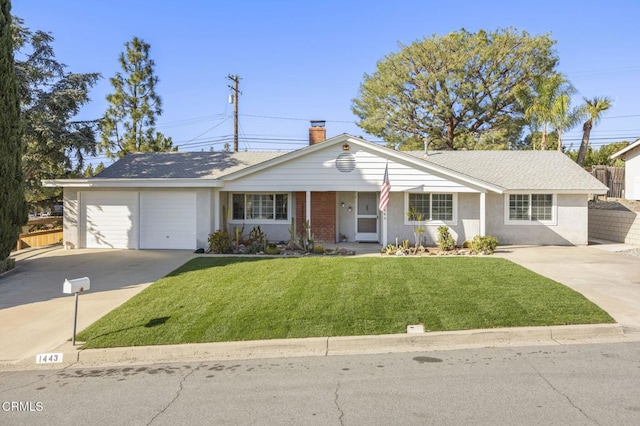 ranch-style house with concrete driveway, a garage, fence, and a front yard