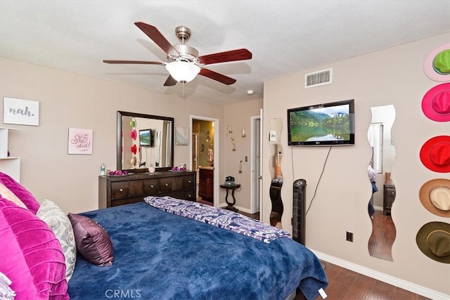 bedroom with visible vents, ceiling fan, baseboards, and wood finished floors