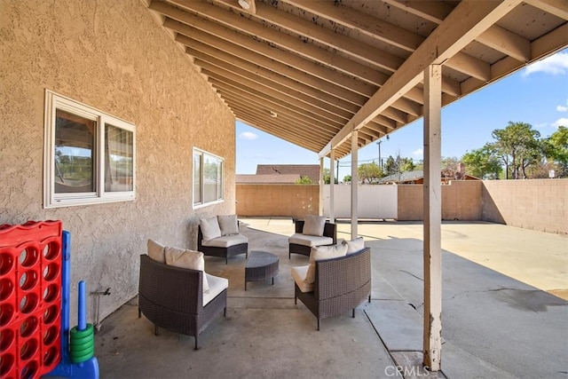 view of patio / terrace with an outdoor hangout area and a fenced backyard