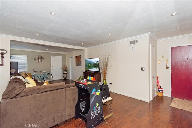 living area with visible vents, ornamental molding, wood finished floors, recessed lighting, and baseboards