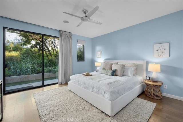 bedroom with access to outside, wood finished floors, baseboards, and ceiling fan