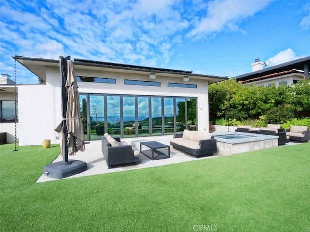 rear view of property with a yard, an outdoor hangout area, and a patio