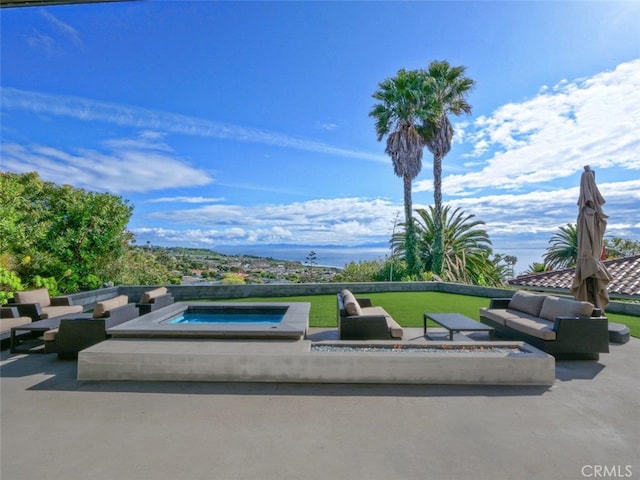 view of patio / terrace featuring an in ground hot tub and an outdoor hangout area