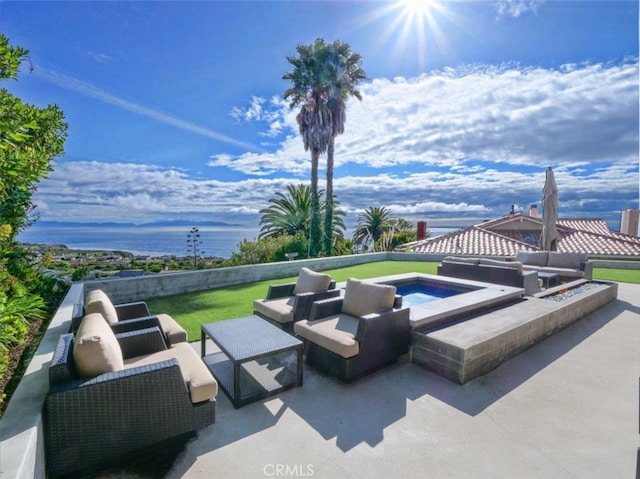 view of patio / terrace with an in ground hot tub and an outdoor hangout area