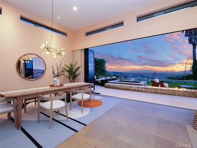 dining area featuring recessed lighting, wood finished floors, visible vents, and a chandelier