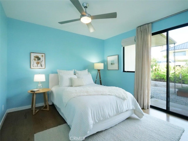 bedroom featuring a ceiling fan, access to exterior, wood finished floors, and baseboards