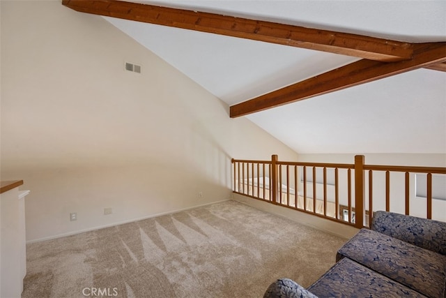 interior space with visible vents, vaulted ceiling with beams, and carpet