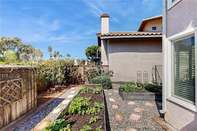 view of yard featuring a vegetable garden and a fenced backyard