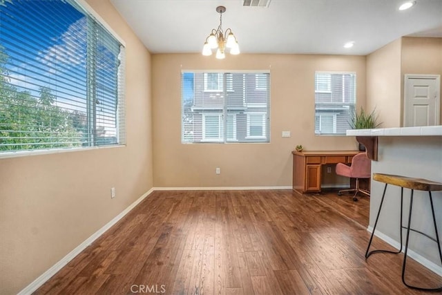 dining space with recessed lighting, a chandelier, baseboards, and dark wood-style floors