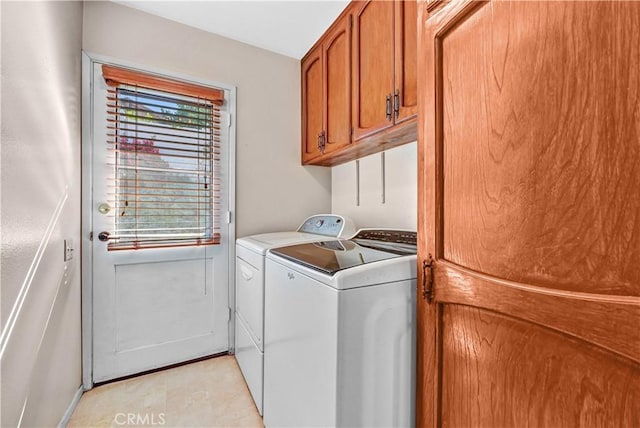 laundry room with cabinet space and washer and dryer