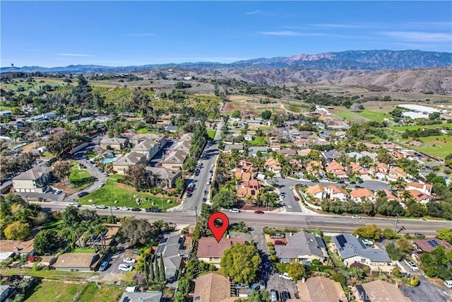 drone / aerial view with a residential view and a mountain view