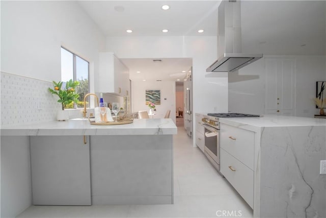 kitchen with ventilation hood, modern cabinets, white cabinets, and stainless steel range