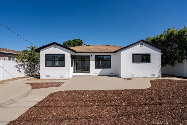 back of property featuring crawl space, a patio area, stucco siding, and fence