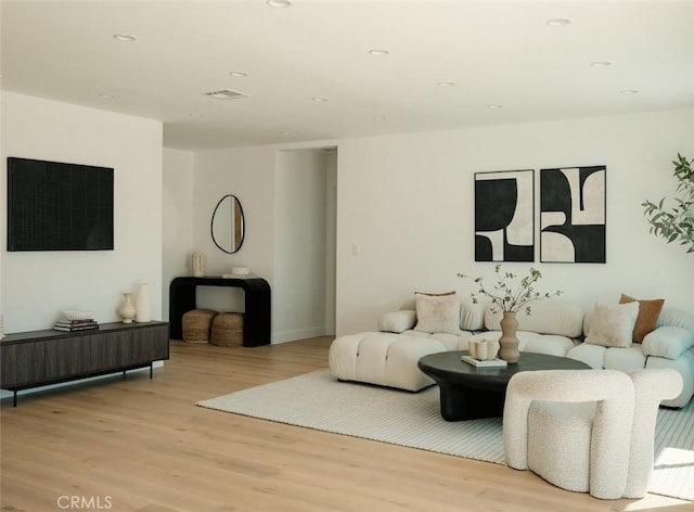 living room featuring recessed lighting and wood finished floors