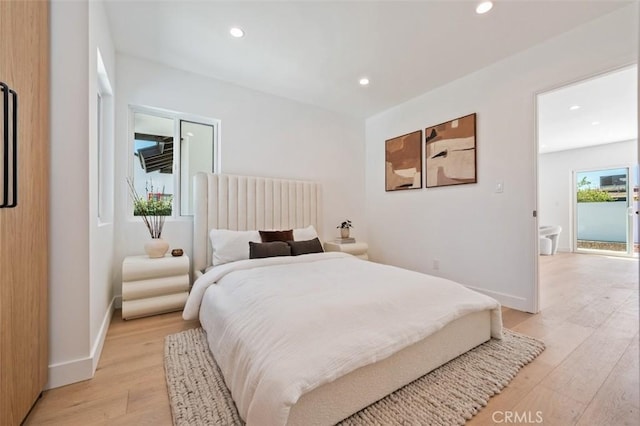 bedroom featuring recessed lighting, light wood-type flooring, and baseboards