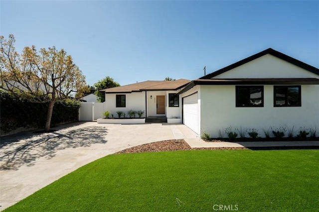 ranch-style home featuring stucco siding, fence, concrete driveway, a front yard, and a garage