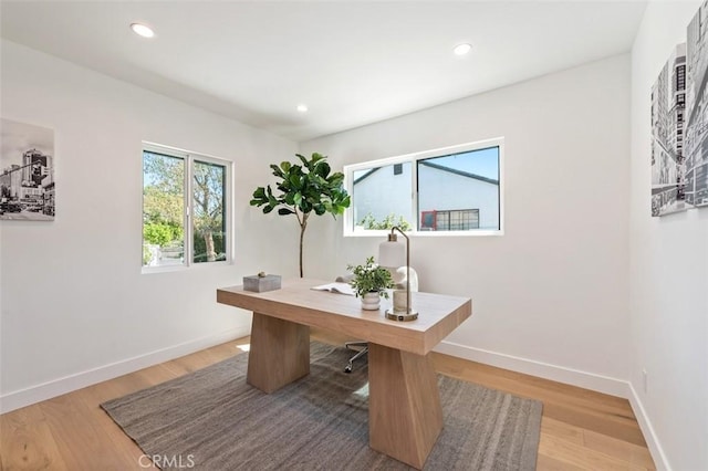 home office featuring recessed lighting, light wood-style floors, and baseboards