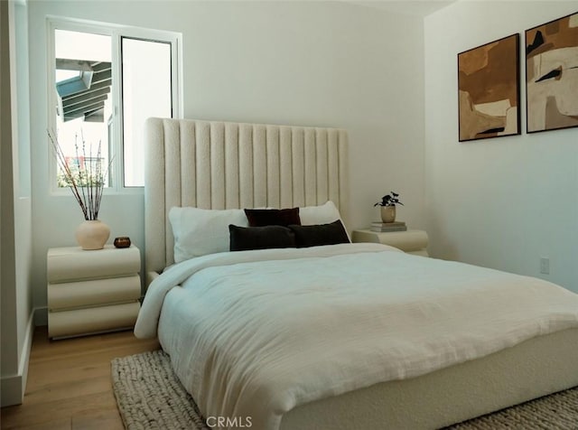 bedroom featuring wood finished floors