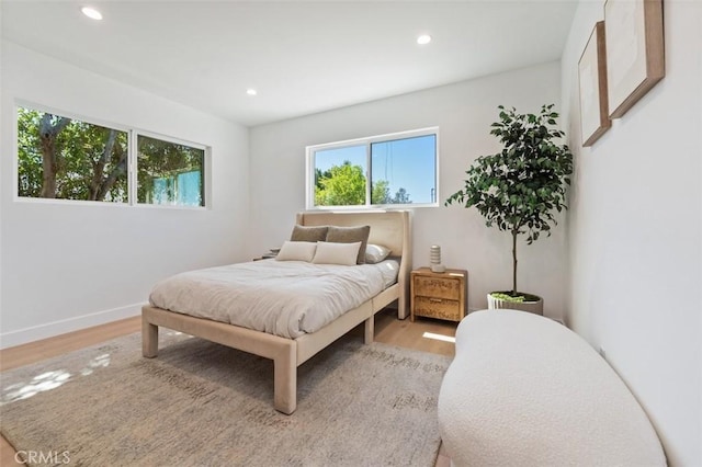 bedroom featuring recessed lighting, baseboards, and wood finished floors