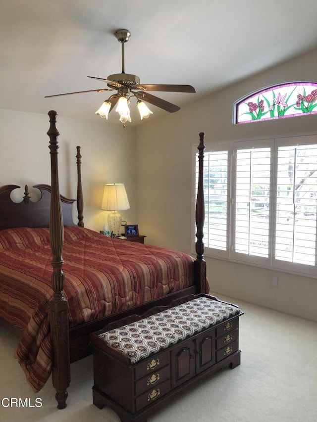 bedroom with light colored carpet and a ceiling fan