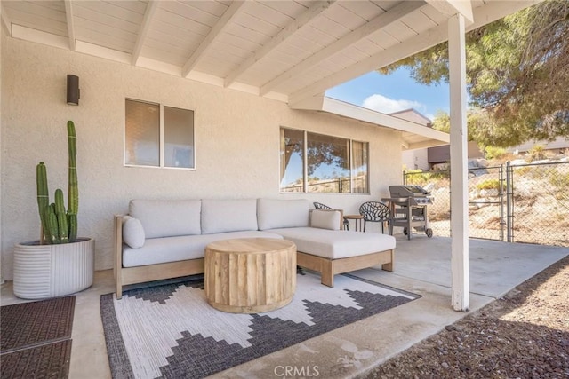 view of patio / terrace with area for grilling, fence, and an outdoor hangout area