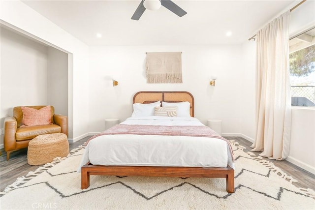 bedroom with ceiling fan, baseboards, wood finished floors, and recessed lighting